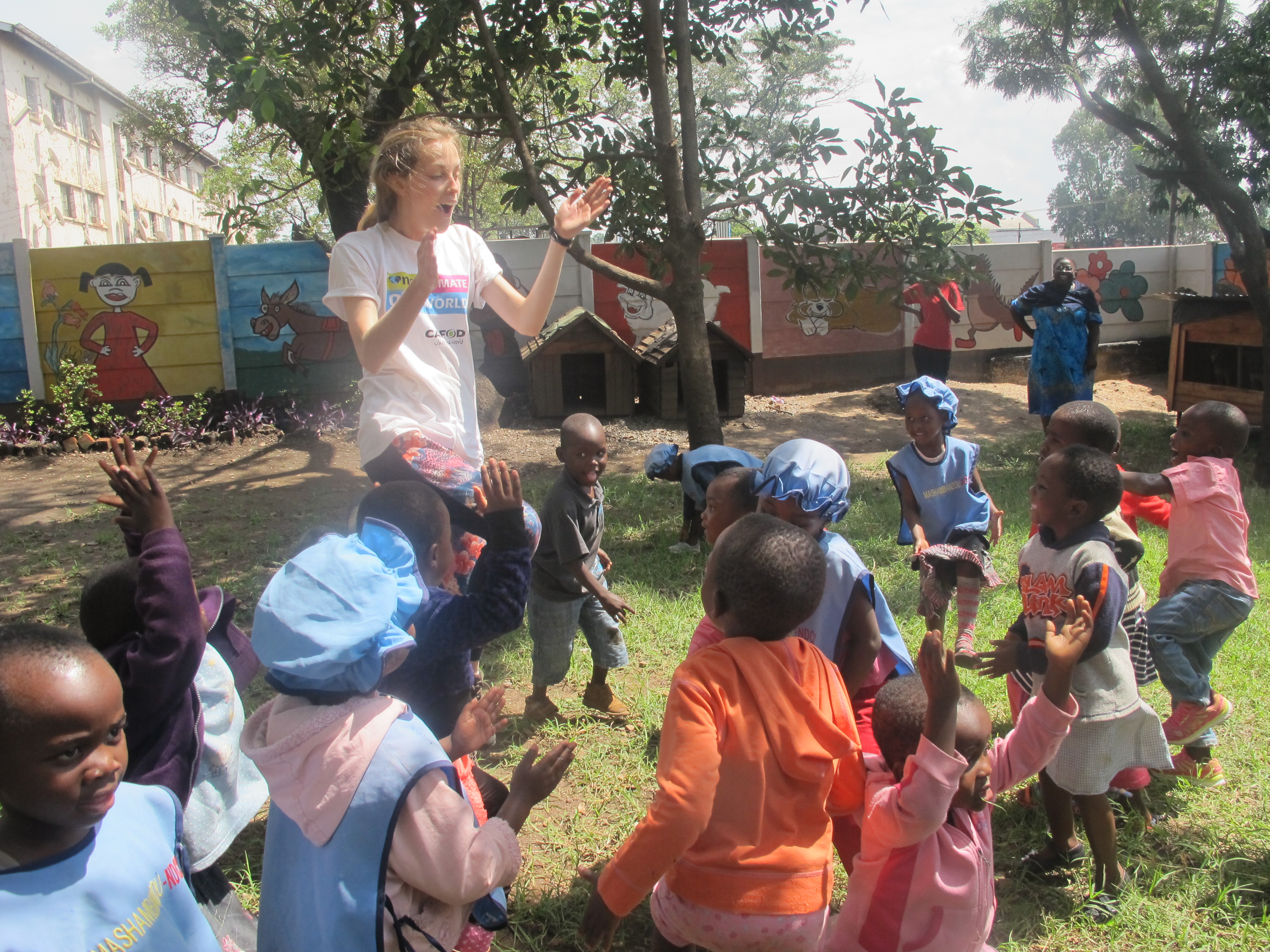 Mary leading the children in games